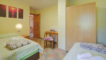 Apartamento família, vários quartos, 2 banheiros (Rododendro) | 3 quartos, roupa de cama