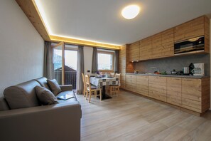 Family Apartment, Multiple Bedrooms (Volga) | Living area | 24-inch flat-screen TV with satellite channels, TV - Volga (Livigno)
