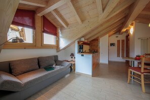 Family Apartment, Multiple Bedrooms (Loira) | Living area | 24-inch flat-screen TV with satellite channels, TV - Volga (Livigno)