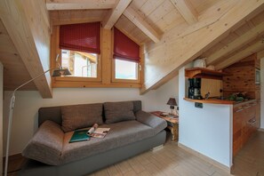 Family Apartment, Multiple Bedrooms (Loira) | Living area | 24-inch flat-screen TV with satellite channels, TV - Volga (Livigno)