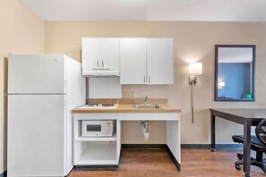 Premium bedding, desk, laptop workspace, iron/ironing board