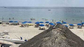 On the beach, sun loungers, beach towels