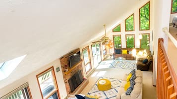 Smart TV, fireplace, table football, books