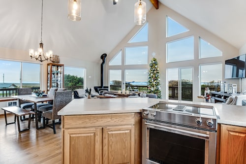 Spacious coastal home with private hot tub, ocean view, wood stove & EV charging