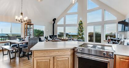 Spacious coastal home with private hot tub, ocean view, wood stove & EV charging