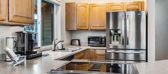 Spacious coastal home with private hot tub, ocean view, wood stove & EV charging