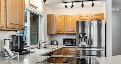 Spacious coastal home with private hot tub, ocean view, wood stove & EV charging