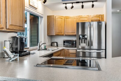 Spacious coastal home with private hot tub, ocean view, wood stove & EV charging