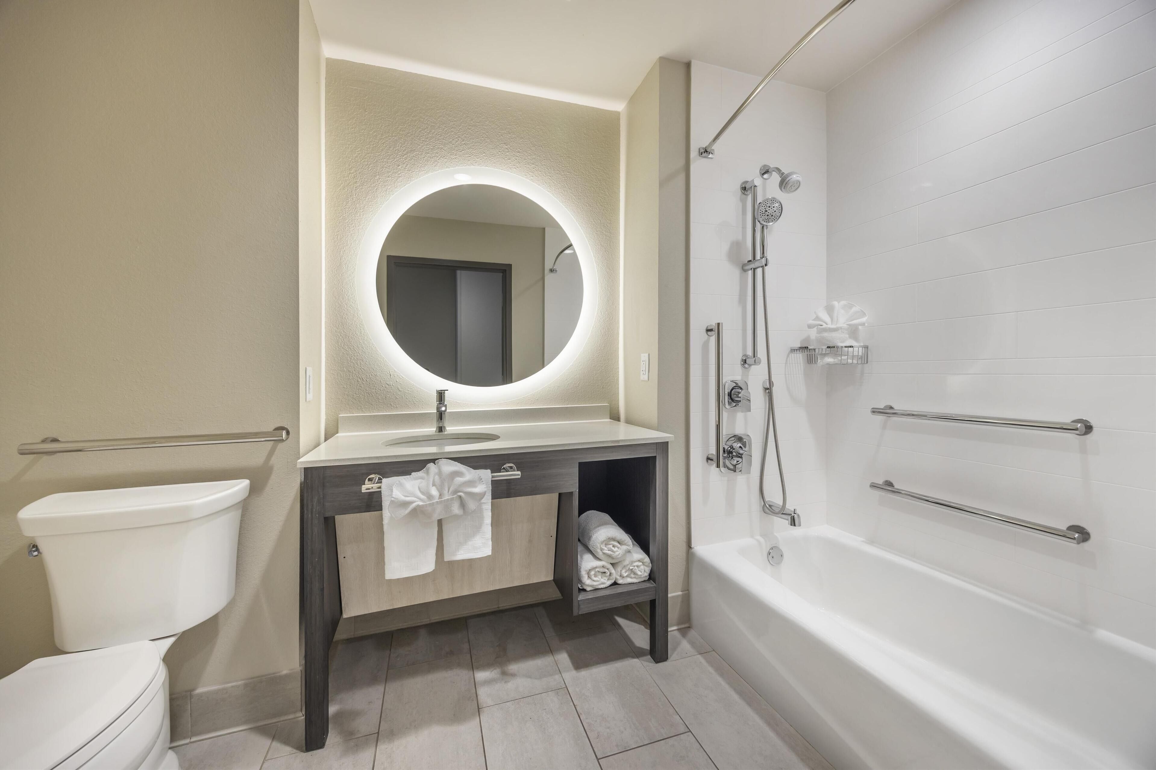 suite, 1 king bed, accessible, refrigerator & microwave (with sofabed) | bathroom | shower, hair dryer, towels, soap