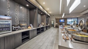 A buffet area with a self-service station, a coffee machine, and various food options. - Best Western Plus Executive Residency Jackson Northeast (Jackson)