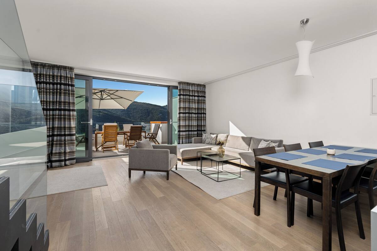 Comfort Apartment, Bay View | Living area | Flat-screen TV, heated floors
