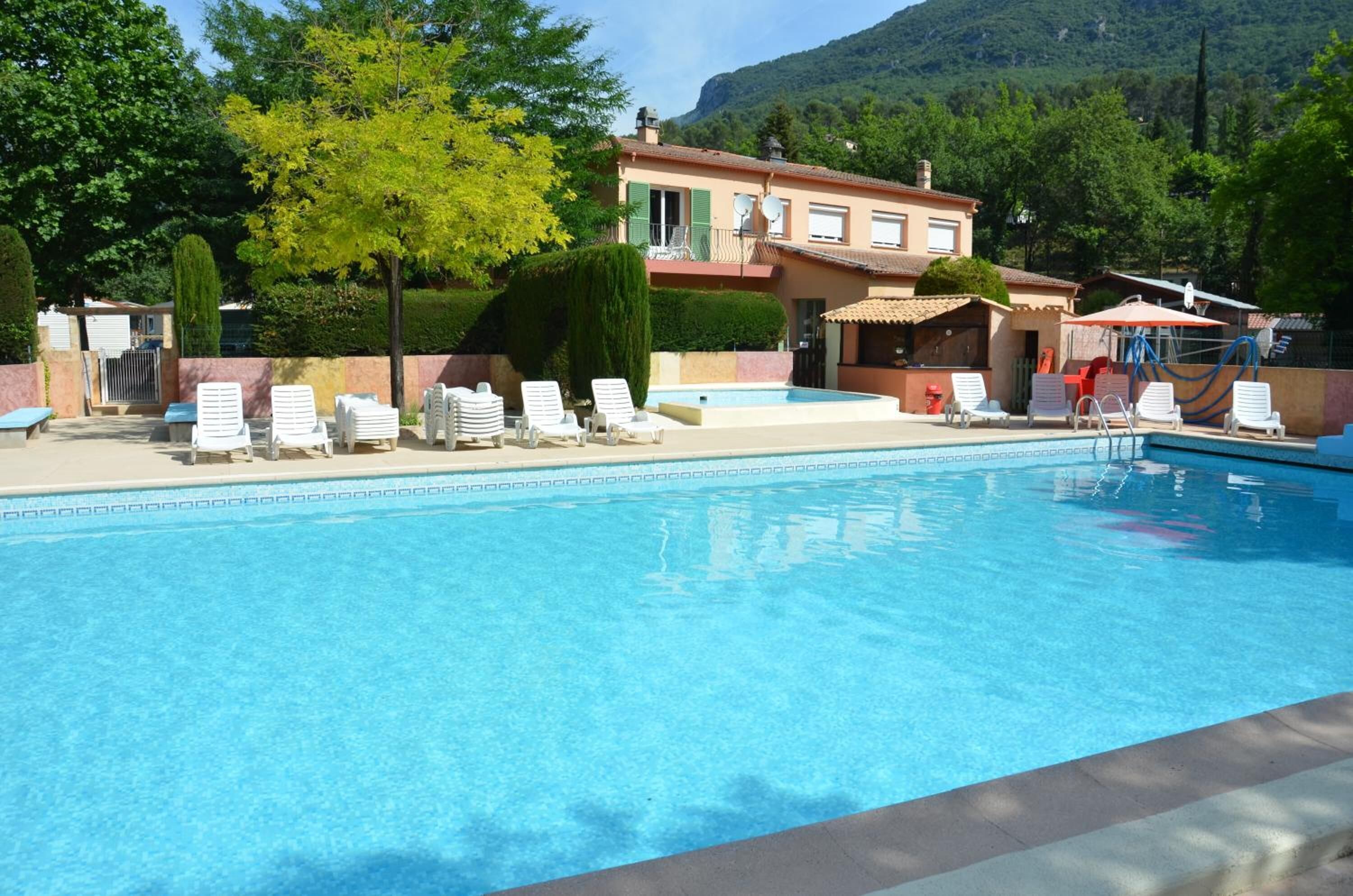 Seasonal outdoor pool, open 9:00 AM to 7:00 PM, pool umbrellas