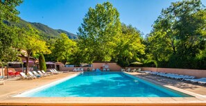 Seasonal outdoor pool, open 9:00 AM to 7:00 PM, pool umbrellas