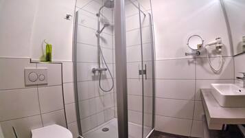 Shower, hair dryer, towels, toilet paper