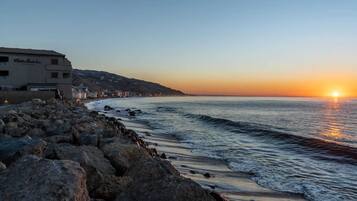 On the beach, sun loungers, beach towels