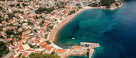On the beach, sun loungers, beach towels