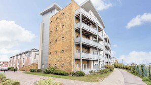 A multi-story residential building with a brick facade and balconies. - Beach Point - Stunning Harbour Views from Balcony (Poole)