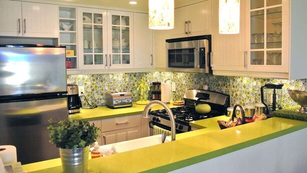 A modern kitchen with white cabinets, a stainless steel refrigerator, a microwave, a stove, and a yellow countertop. - **Mickeys Hideaway**Walk to Disneyland**Summer Fun! (Anaheim)
