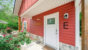 A red house with a white door, a mailbox, and a stone foundation. - GrandLake*Kayak*ForestView*Firepit*Kings*Lakefront (Grove)