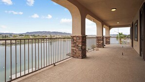 A covered outdoor area with a view of a river and mountains. - RIVERFRONT PARADISE OASIS W/ PRIVATE BEACH & BOAT DOCK (Mohave Valley)