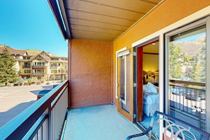 Enjoy a view of the surrounding landscape from this hotel room's balcony.