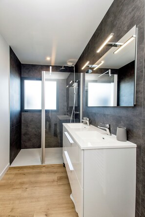 Shower, hair dryer, towels, soap