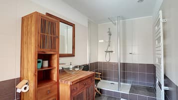 Shower, hair dryer, towels, toilet paper