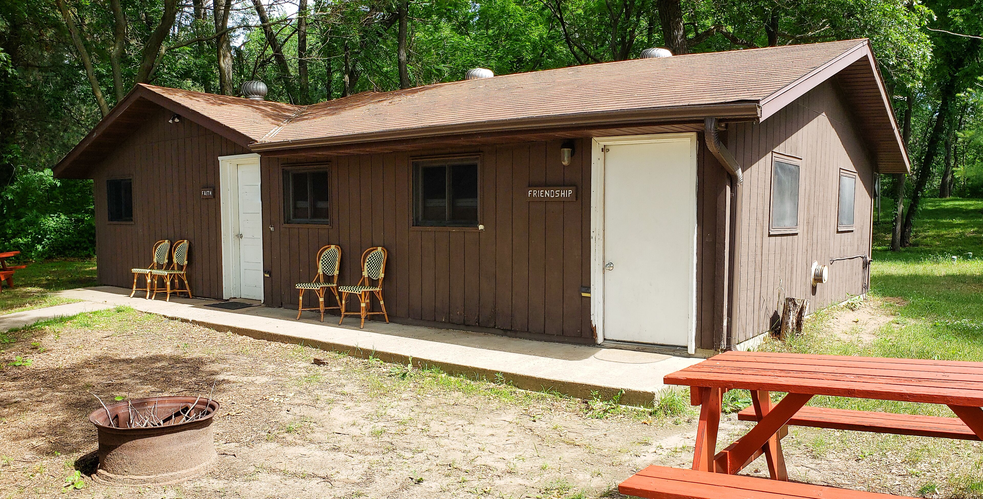 This camper cabin with attached bathroom makes the perfect summer camp retreat!