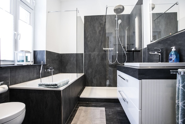 Bathtub, hair dryer, towels, soap