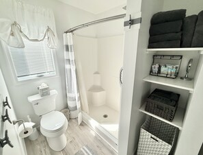 Shower, hair dryer, towels, soap