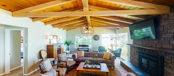 Inviting bayside dwelling with beach access, deck, waterfront views, & fireplace