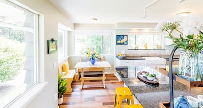 Inviting bayside dwelling with beach access, deck, waterfront views, & fireplace
