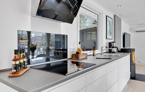 Fridge, stovetop, dishwasher, coffee/tea maker