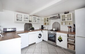 Fridge, stovetop, dishwasher, coffee/tea maker