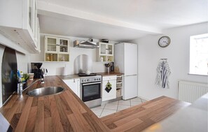 Fridge, stovetop, dishwasher, coffee/tea maker