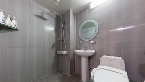 A modern bathroom with a shower, sink, and toilet. - NJ Hotel (Pyeongtaek)