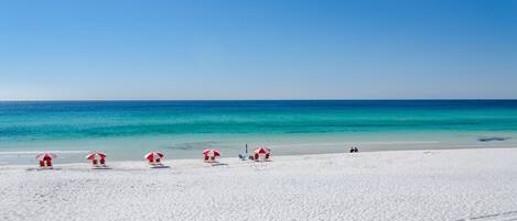 On the beach, sun loungers, beach towels