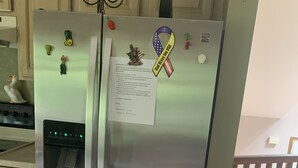 A stainless steel refrigerator with a water dispenser, magnets, and a ribbon. -  EL EDEN PLACE TO REST AND ENJOY (EL EDEN LUGAR PARA DESCANSAR Y DISFRUTAR  (Bushkill)
