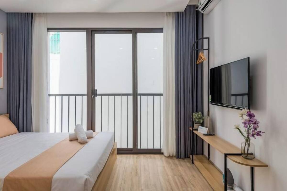 Minibar, desk, laptop workspace, iron/ironing board