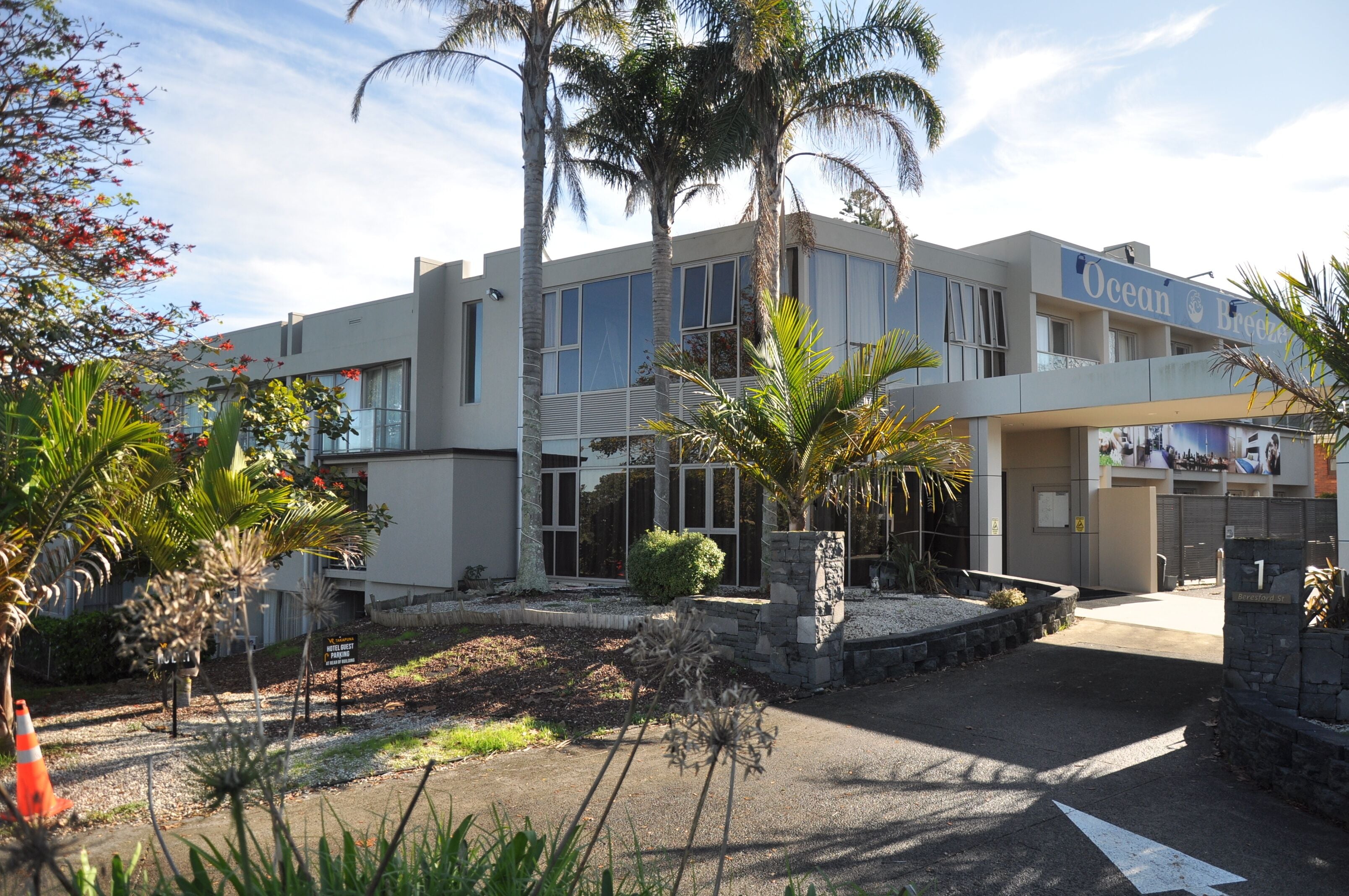 A modern building with a sign reading "Ocean Breeze."