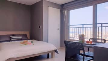 Desk, laptop workspace, blackout curtains, soundproofing