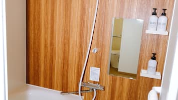 Holiday Home | Bathroom | Rainfall showerhead, free toiletries, hair dryer, slippers