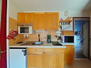 Fridge, microwave, stovetop, coffee/tea maker