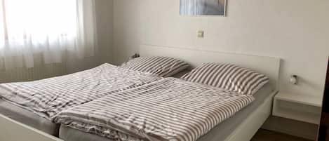 2 bedrooms, travel crib, WiFi, bed sheets