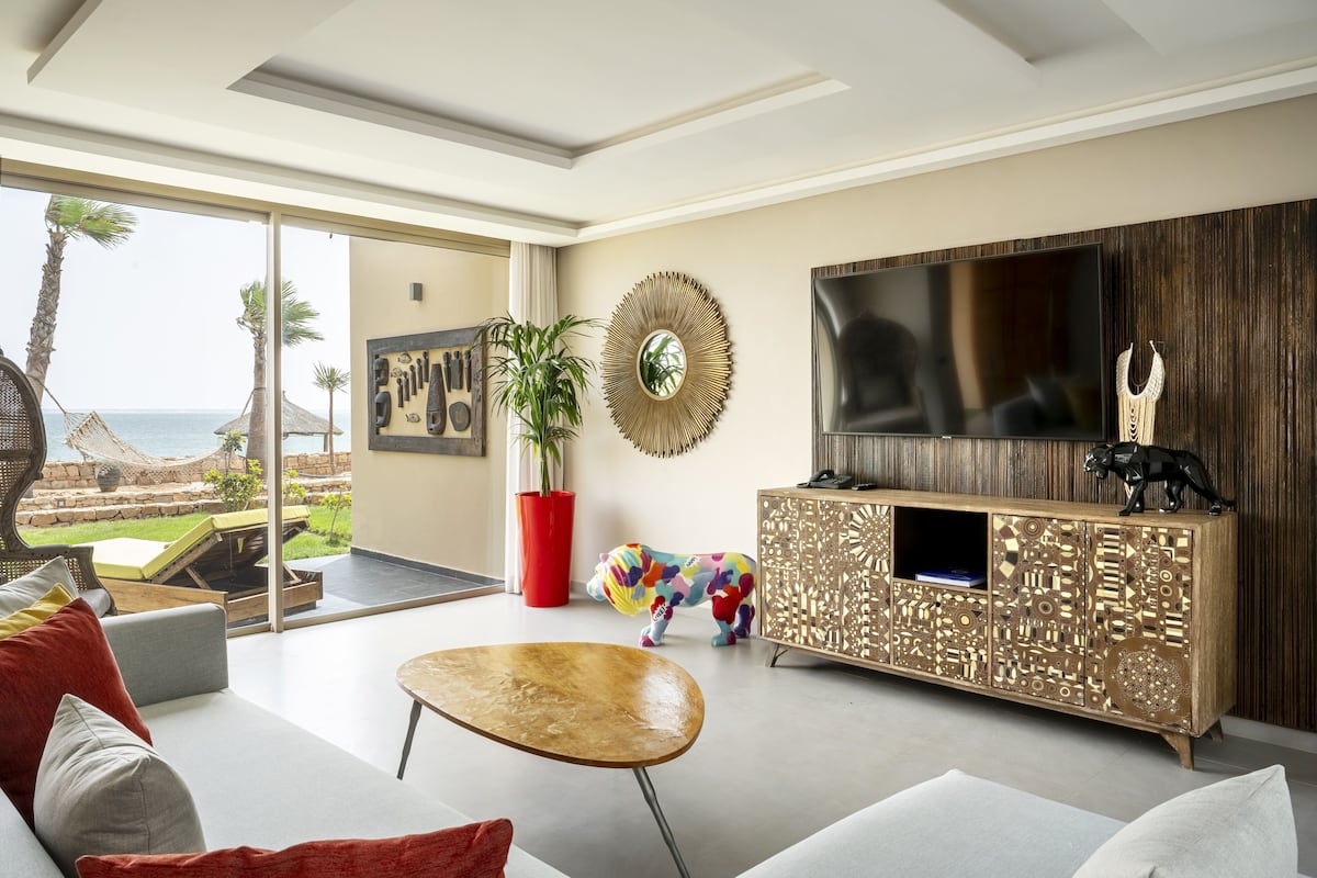 Royal suite, uitzicht op lagune | Woonruimte | Een flatscreentelevisie
