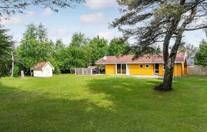 Enjoy living space in this single-family home with a large glass door and windows.