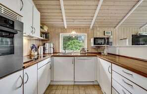 Fridge, stovetop, dishwasher, coffee/tea maker