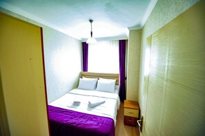 Premium bedding, desk, laptop workspace, soundproofing