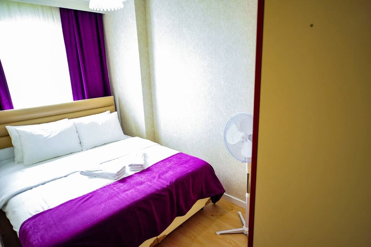 Premium bedding, desk, laptop workspace, soundproofing