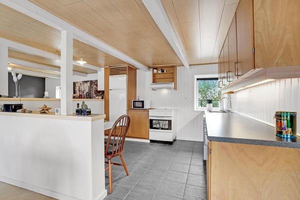 Fridge, stovetop, dishwasher, coffee/tea maker